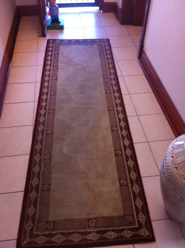 Rug before being cleaned by Priceless Carpet Cleaning