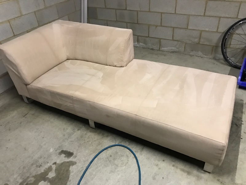White Single Piece Couch after upholstery Cleaning