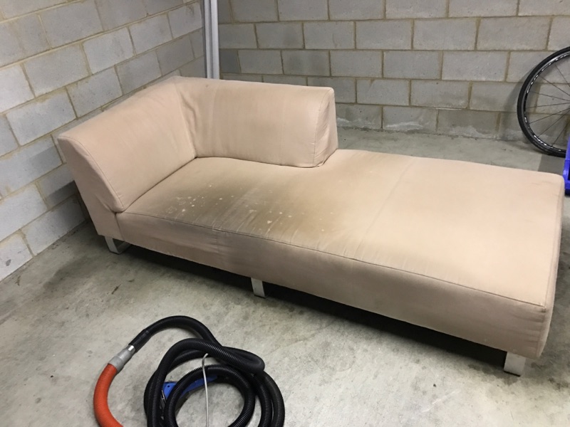White Single Piece Couch before upholstery Cleaning